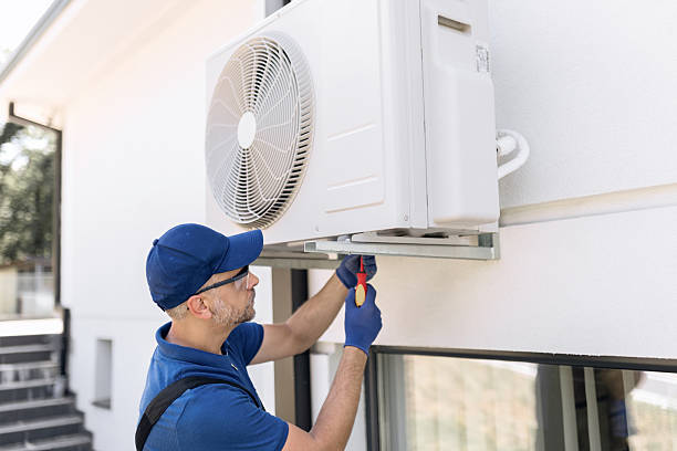 istock Repairman fixing AC outdoor unit. 2246482501