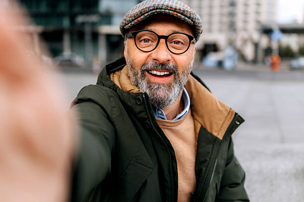 istock Mature man taking selfie in the city 2246483331