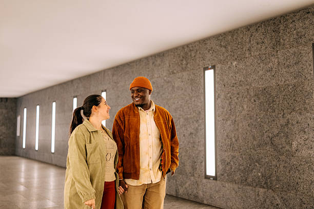 istock Couple walking through subway hallway 2246483481