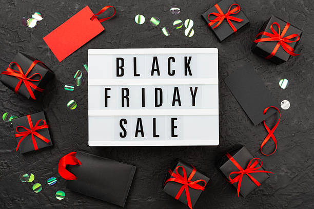 istock Light box with Black friday sale text and gift box on concrete background, top view 2246483723