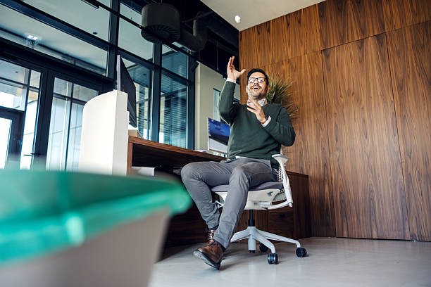 istock Office worker playing with crumpled paper ball 2246485697
