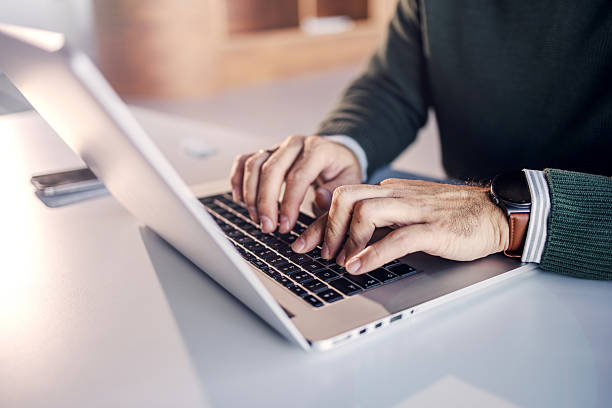 istock Person typing on laptop keyboard, working remotely 2246485847