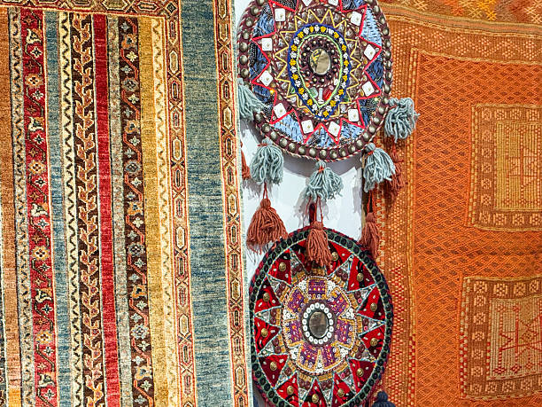 istock Traditional Turkish carpets and round embroidered wall decorations displayed outside a rug store in Istanbul 2246486986