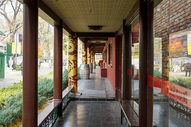 An indoor corridor with colorful columns and glass windows, featuring a tidy and elegant layout.