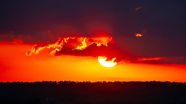Stunning sunset paints the sky with vibrant hues over a distant horizon