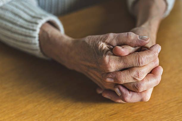 istock Close-up of an elderly woman's hands at home 2246491352