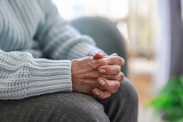 istock Close-up of an elderly woman's hands at home 2246491442