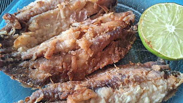 istock Fried fish and a slice of lemon 2246492136