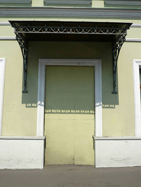 istock old yellow wall with door shape 2246493672