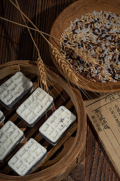 A white sweet pastry made of rice and sesame on a wooden table