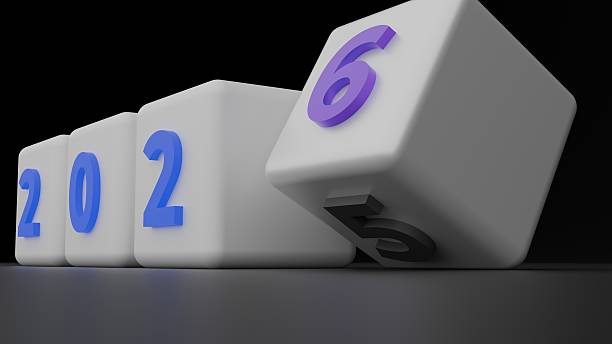 Close Low Camera Angle On White Cubes Where Digits Form 2 0 2 And The Foreground Cube Is Rolling From Five To Six, With Dark Background Copy Space Emphasizing Dynamic New Year Change From 2025 To 2026