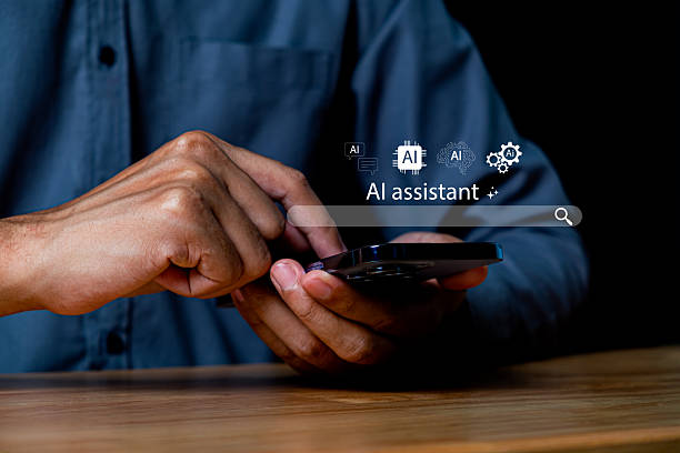 istock Person Using Smartphone to Access AI Assistant for Technology and Digital Solutions in a Modern Workspace Environment 2246500411