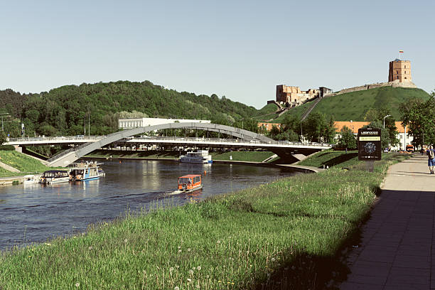 Vilnius, Lithuania – May 23, 2022. Panoramic view of Gediminas Tower and rivier Wilia.  Historical symbol of Vilnius and Lithuania. A well-known tourist site