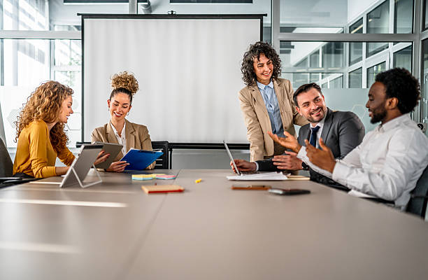 istock Business colleagues collaborating during a cheerful office meeting 2246503275