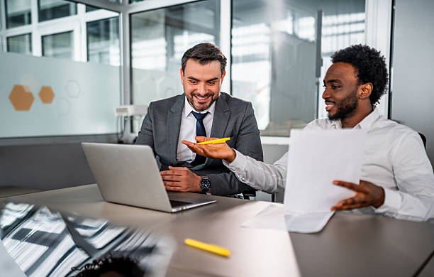 istock Diverse businessmen discussing project details during office meeting 2246505375