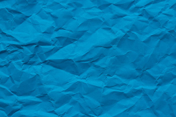istock Macro crumpled blue paper background,Abstract light blue paper texture background. Texture of crumpled craft paper. Paper background. Recycled blue paper backdrop in close up. sky blue Textures. Wallpaper. 2246507115