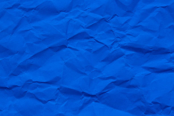 istock Macro crumpled blue paper background,Abstract light blue paper texture background. Texture of crumpled craft paper. Paper background. Recycled blue paper backdrop in close up. sky blue Textures. Wallpaper. 2246507125