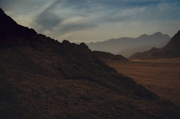 landscape rocky mountains and desert and sky at sunset in Egypt without people
