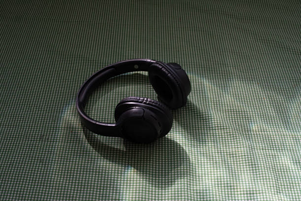 black Headphones on a green table