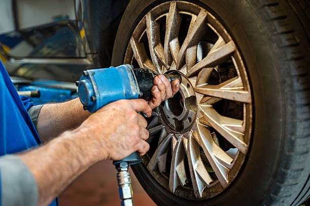 istock Mechanic changing car wheel using impact wrench 2246510496