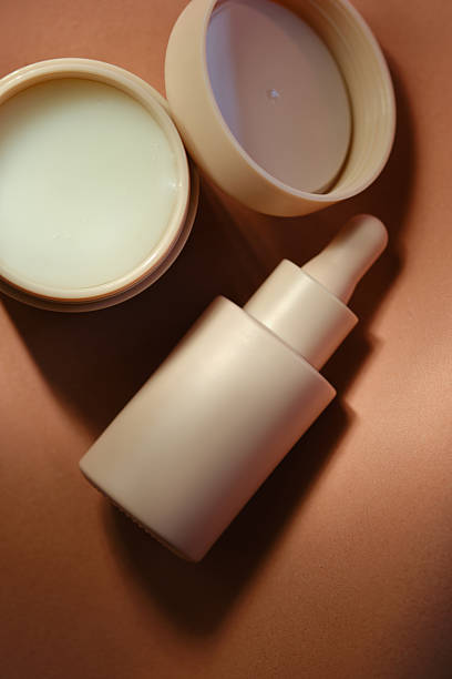 istock Face cream and serum on a soft beige background. 2246511261