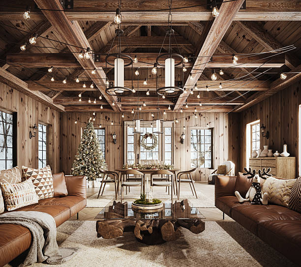 istock Cozy rustic living room decorated for Christmas with warm string lights, a beautifully adorned Christmas tree, and elegant holiday wreath. 2246512178