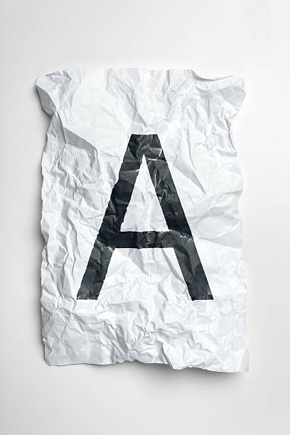 A large, bold letter A on wrinkled white paper creates an interesting visual effect.