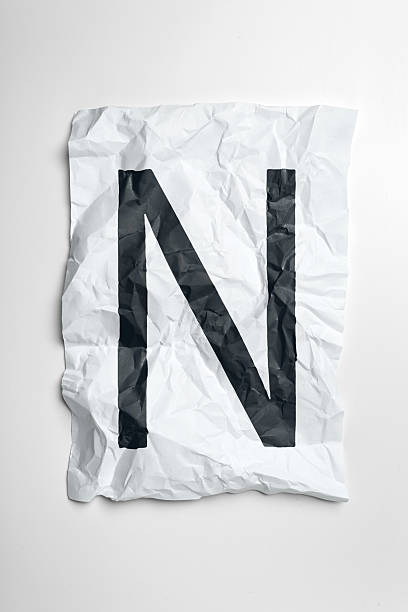 istock Crumpled paper with a large black letter N on a white background 2246514287