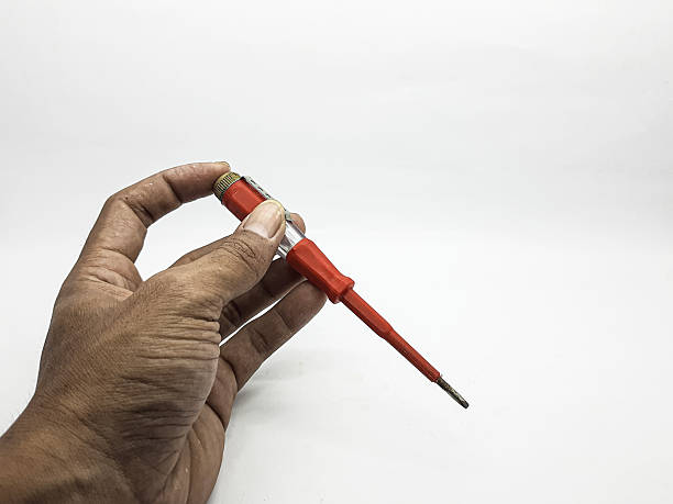 istock Hand Holding Red Precision Screwdriver With Magnetic Bit For Electronics And Repairs, Small Toolkit Essential 2246515876
