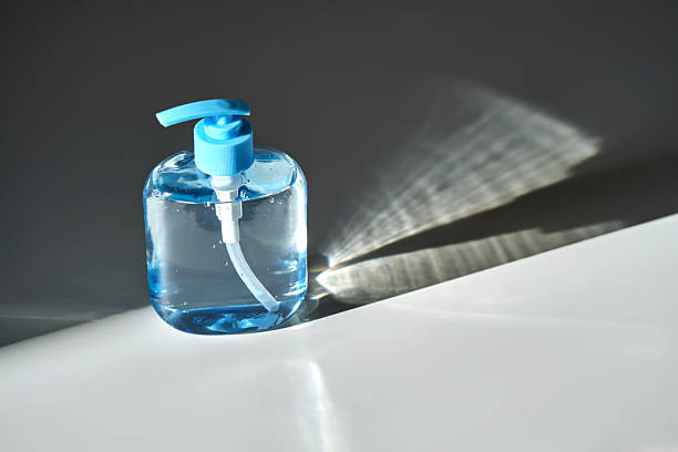 istock Hand washing gel in a blue bottle with a dispenser on a white background. 2246516809