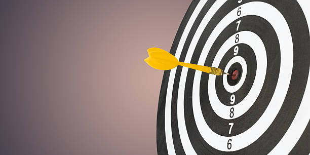 istock Dart hits the bullseye on black and white target during indoor practice session 2246517996