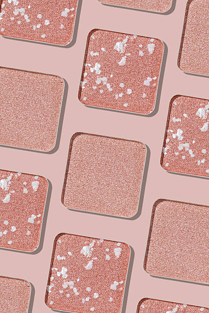 istock Cosmetics texture pattern, makeup palette pale pink color eye shadow, square eye powder swatches. Female cosmetic and beauty products, aesthetic minimal beauty photo, colorful eyeshade, top view 2246518370