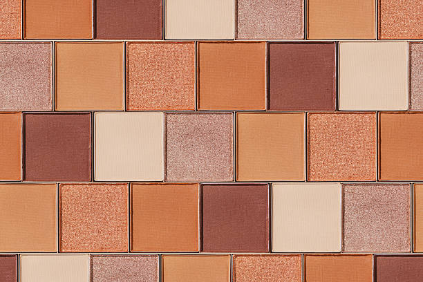 istock Swatches eyeshadow refills as minimal graphic pattern. Matte and glitter pans beige brown copper shade, detailed texture, sun light, minimal trend cosmetics background, beauty product, eye makeup 2246518392