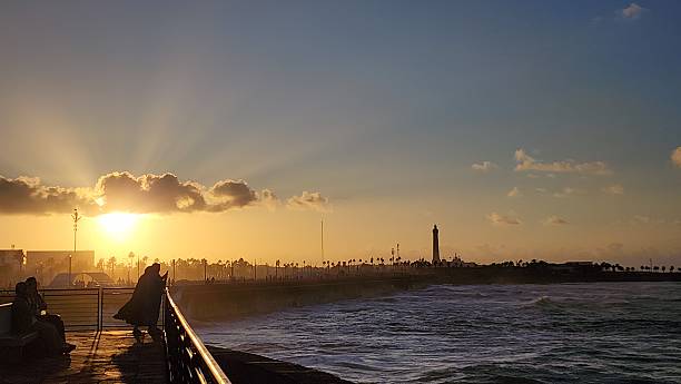istock Dramatic sunset cloudy orange sky, sunbeam through the clouds, sunset in the sea view 2246519745