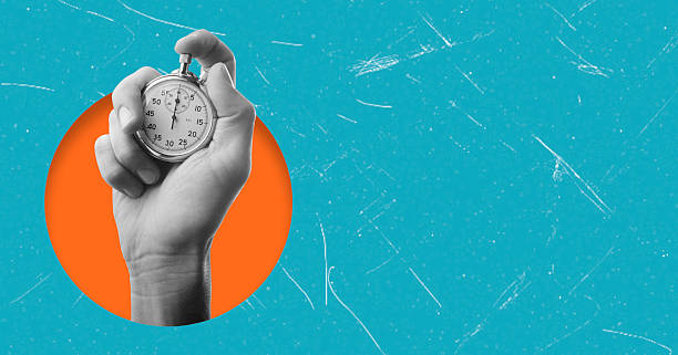 istock Hand holding a stopwatch against a bright background, symbolizing time management and urgency in daily tasks 2246524925