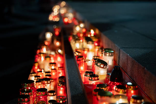istock Dense candle rows stretching along Krastmala steps with numerous glowing lantern jars, showing warm hues, reflective surfaces and a carefully structured arrangement that forms an atmospheric evening tribute corridor 2246526644