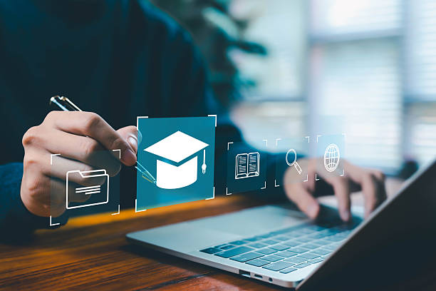 istock A person selecting digital education icons on a laptop, featuring an online learning platform, graduation cap symbol, study materials, research tools, and modern e-learning technology for development. 2246528329