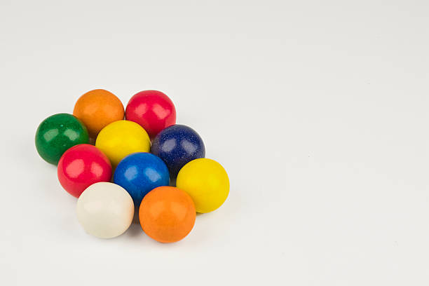 istock Round, colorful chewing gum in the foreground on a white background 2246530392