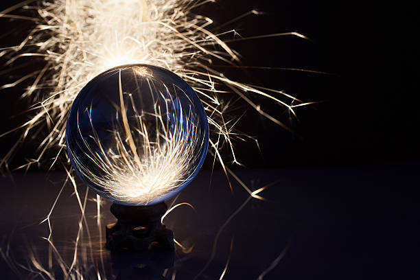 istock Sparks and Glass. A crystal ball with bright sparks creating a dynamic and mysterious atmosphere. 2246530654