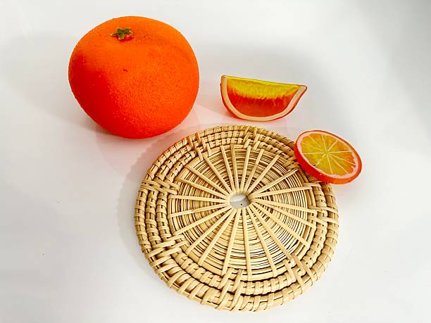 istock Vibrant Orange Fruit Display with Decorative Round Mat and Colorful Fruit Slices for Decor and Culinary Concepts 2246535546