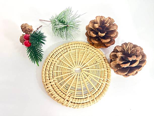istock Rustic Natural Decorative Elements Arrangement with Pine Cones, Greenery, and Woven Plate for Craft or Seasonal Home Decor Display 2246536544