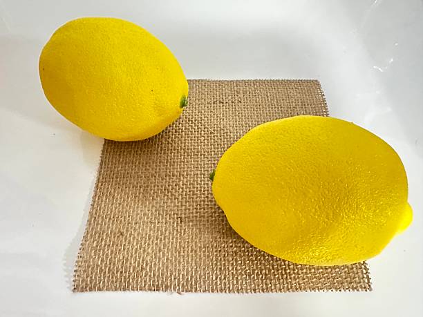 istock Fresh and Vibrant Lemons on a Natural Rustic Surface Perfect for Culinary or Decorative Use in Kitchen or Dining Aesthetic 2246536753