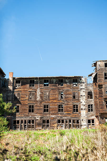 istock Abandoned wooden building with weathered facade 2246538671
