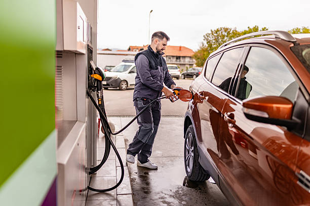 istock Refueling a car at a gas station during a cloudy day 2246543358
