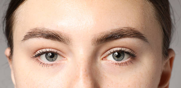 istock Woman with beautiful eyes on light grey background, closeup 2246544574