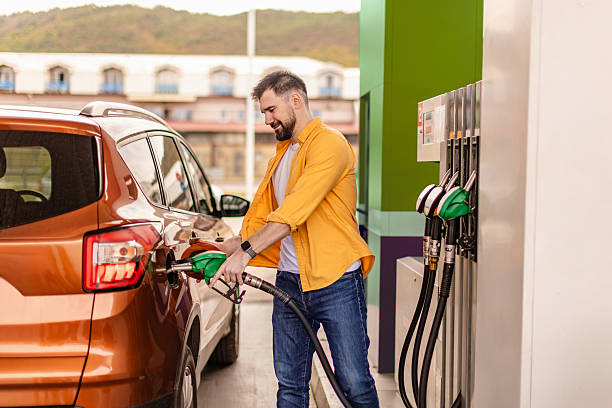 istock Refueling at a busy gas station with a customer using a fuel pump on a sunny day 2246544883