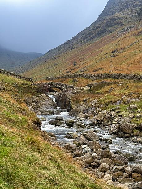 istock Stone Bridge Over The River Derwent, Cumbria, England 2246545157