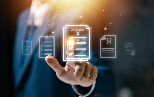 istock Businessman touching virtual certification document icon. Concept of online approval, quality assurance, document verification, and business authorization system. 2246545197