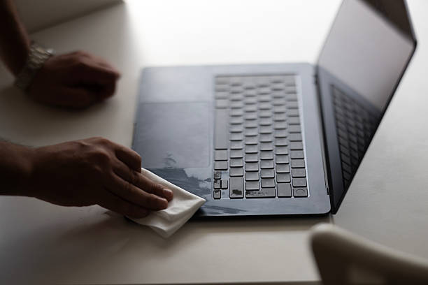 istock Man of cleaning computer keyboard, cleaning concept 2246545249