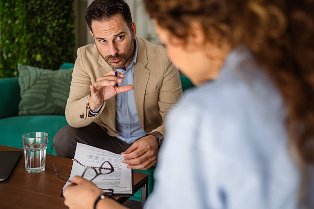 istock Male professional discussing with client in consultation session 2246546543
